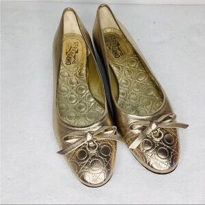 Salvatore Ferragamo Gold Flats with Bow Detail